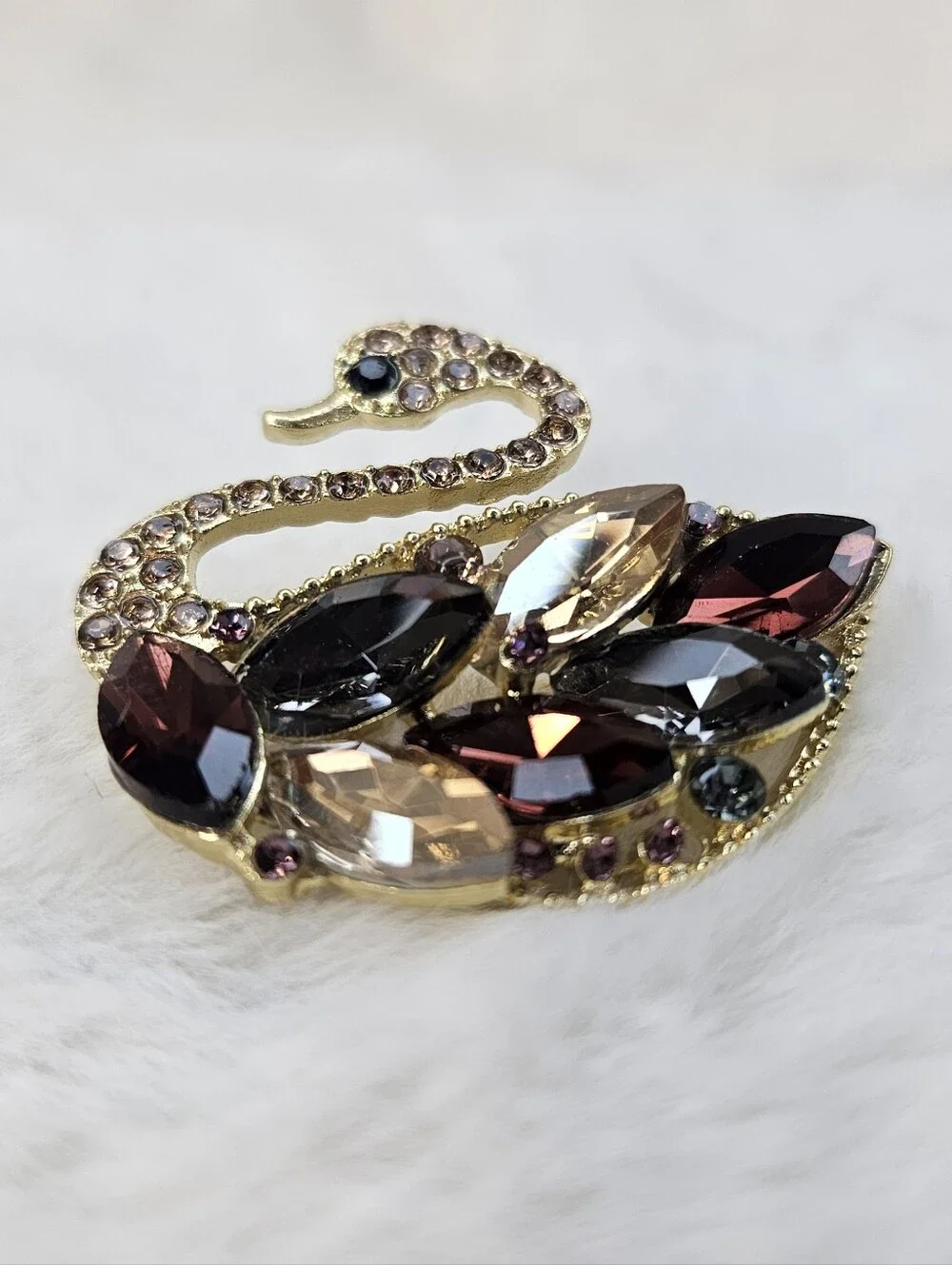 Gold-Tone Swan Brooch with Burgundy and Champagne Crystals
